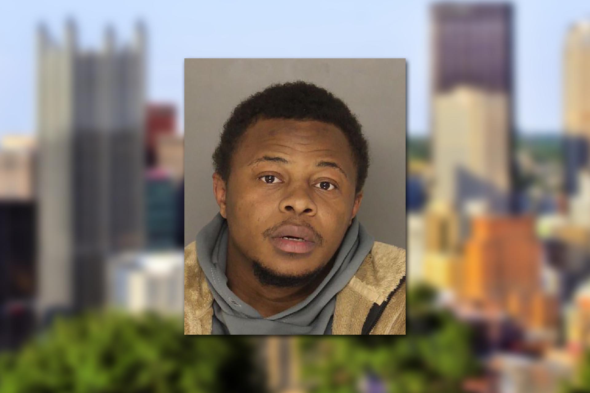 Arnez Johnson. Mugshot provided by the Allegheny County Jail. Background photo credit: Bruce Emmerling / Pixabay.