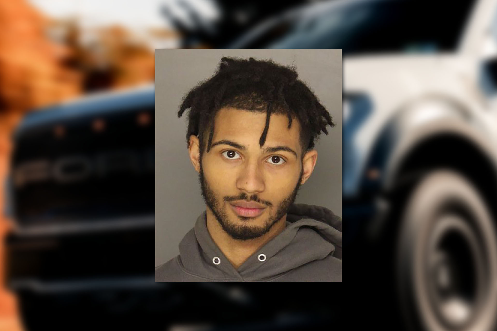 Jaimar Coleman. Mugshot provided by the Allegheny County Jail. Background photo credit: Matt Weissinger/Pexels.