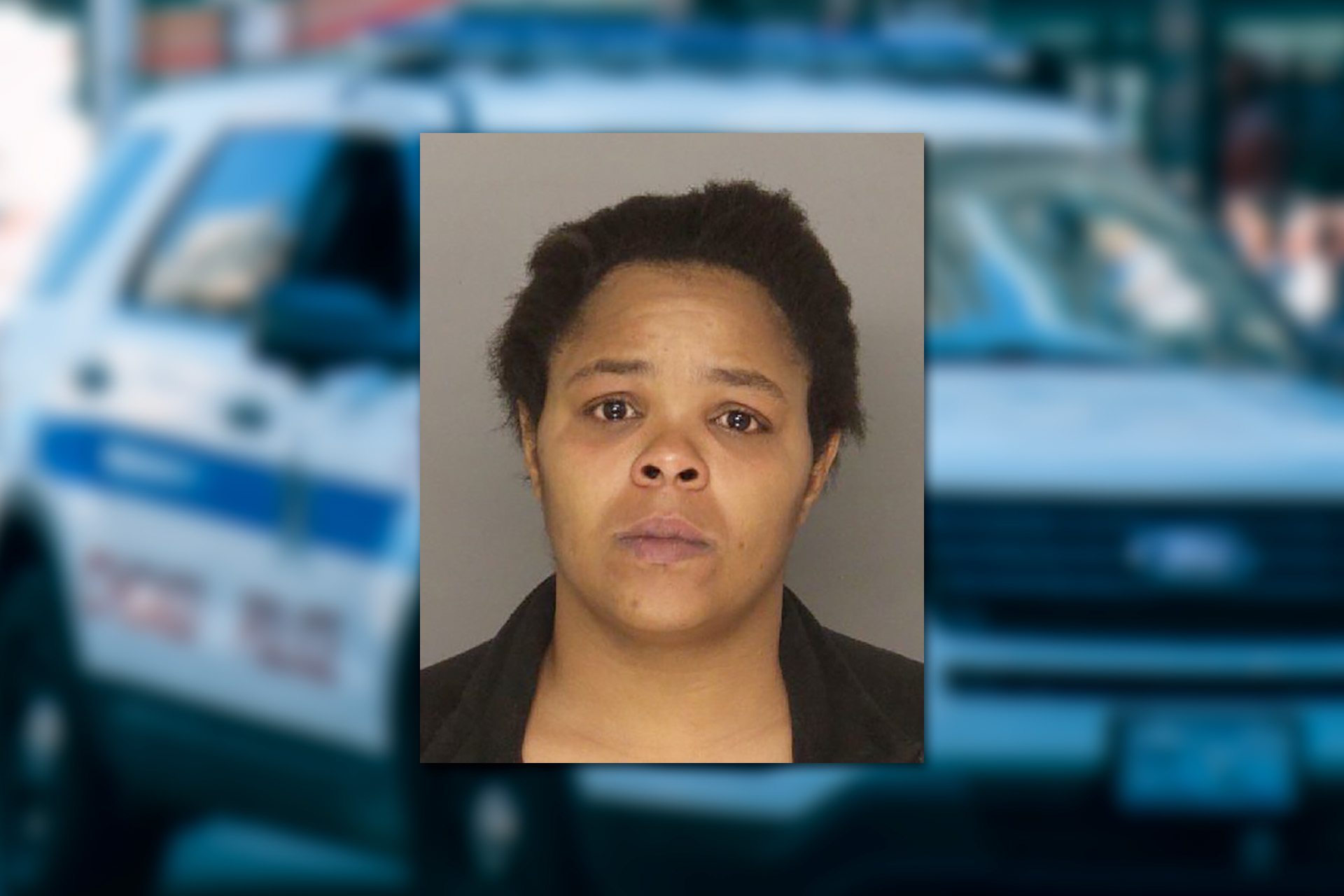 Laodicea Roberts. Mugshot provided by the Allegheny County Jail. Background photo credit: Ricky Esquivel / Pexels.