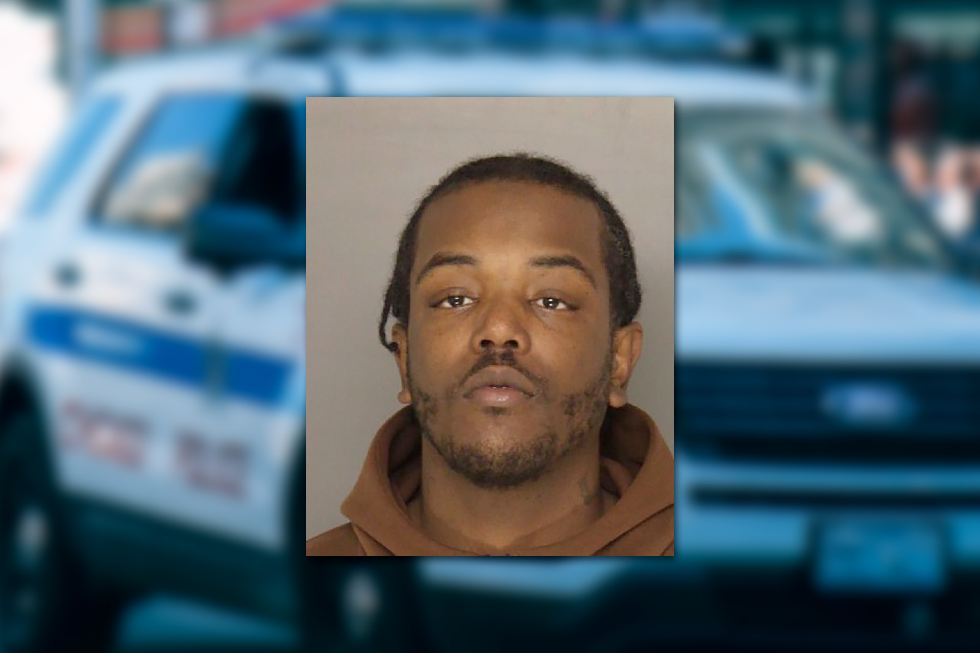 Tyrone West. Mugshot provided by the Allegheny County Jail. Background photo credit: Ricky Esquivel / Pexels.