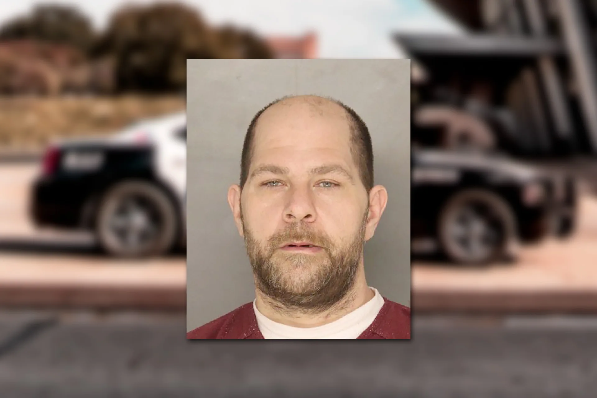 Albert Andy Hvasta. Mugshot provided by the Allegheny County Jail. Background photo credit: Jacoby Clarke / Pexels.