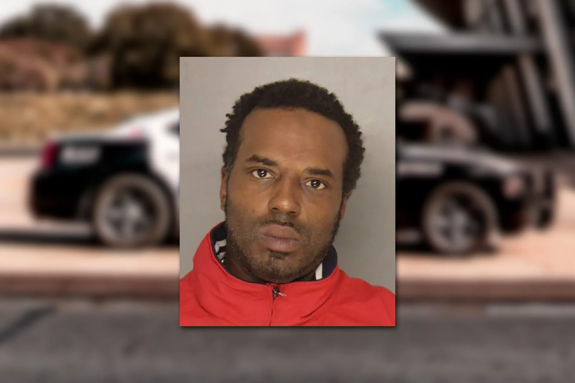 Carlos D Hamlin. Mugshot provided by the Allegheny County Jail. Background photo credit: Jacoby Clarke / Pexels.