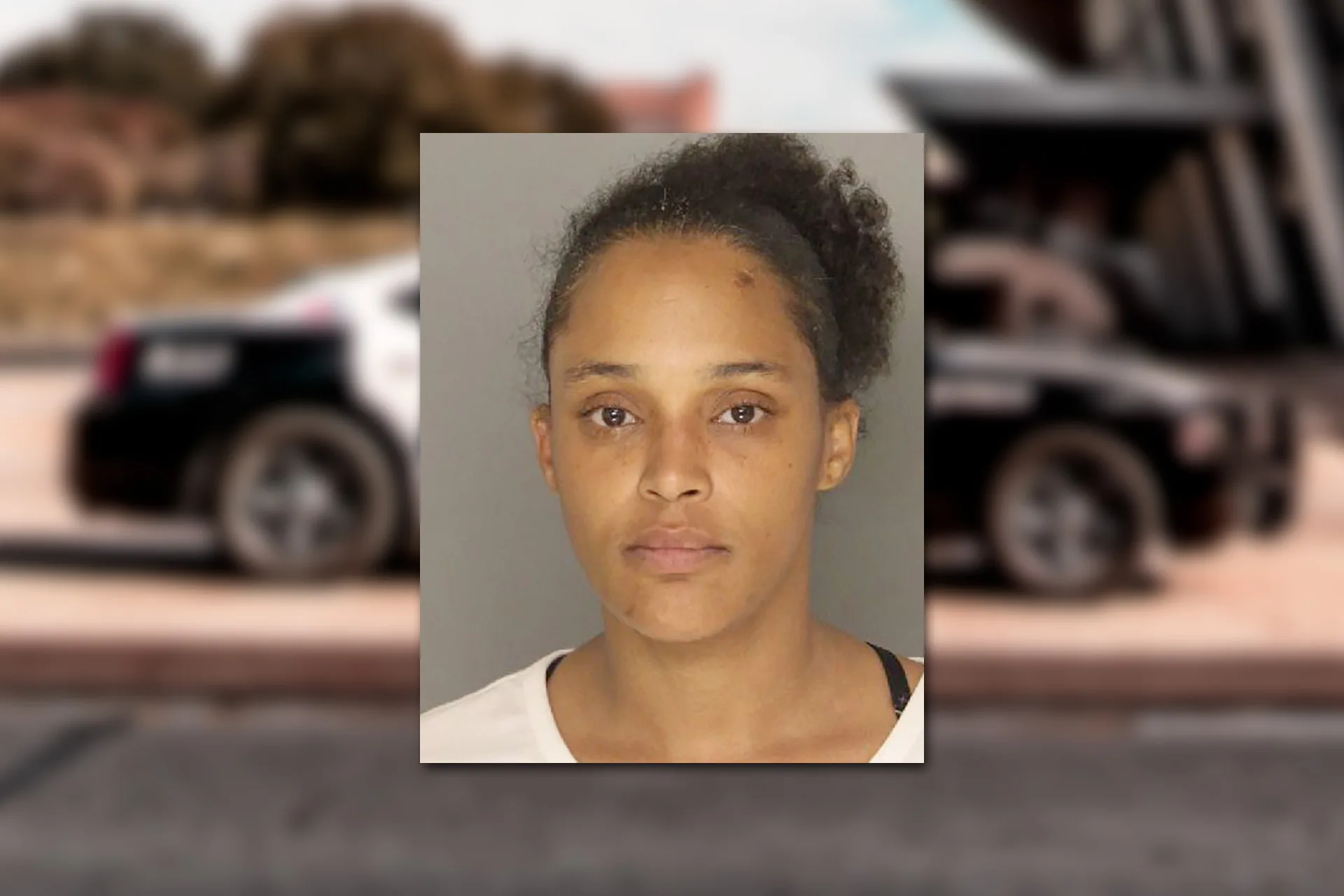 Jvyvone M. Atkinson. Mugshot provided by the Allegheny County Jail. Background photo credit: Jacoby Clarke / Pexels.