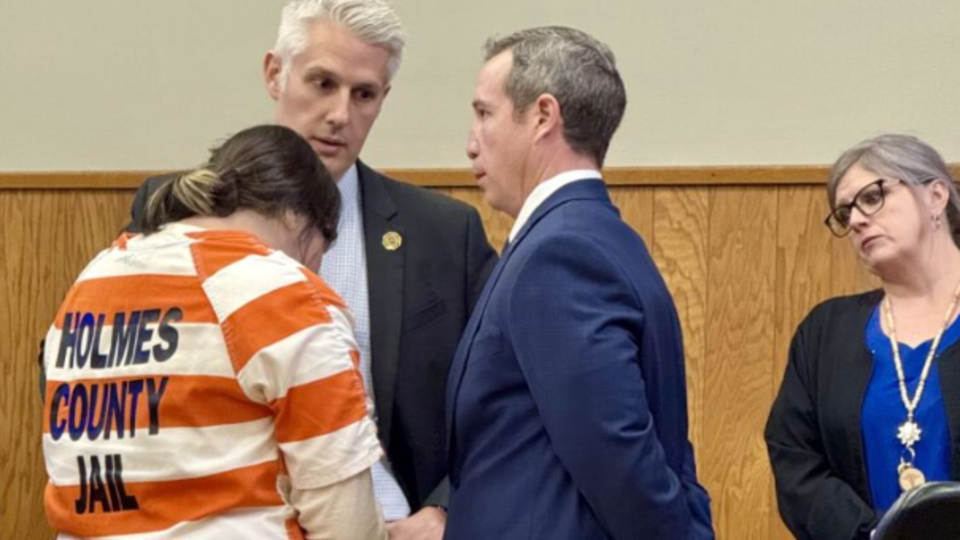 Kathreen Adams, left, speaks with her attorneys following sentencing. (via Florida State Attorney's Office, 14th Circuit)