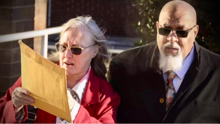 Cedric and Denise Lodge enter the Herman T. Schneebeli Federal Building and Courthouse for sentencing via WBUR
