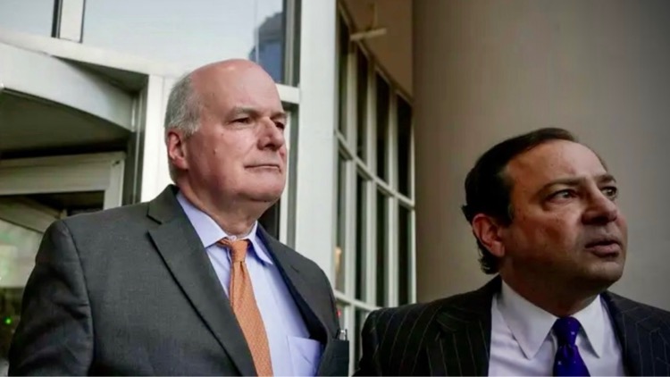 Dr. John Stevenson Bynon Jr. flanked by his attorney Samy Khalil (via Houston Chronicle)